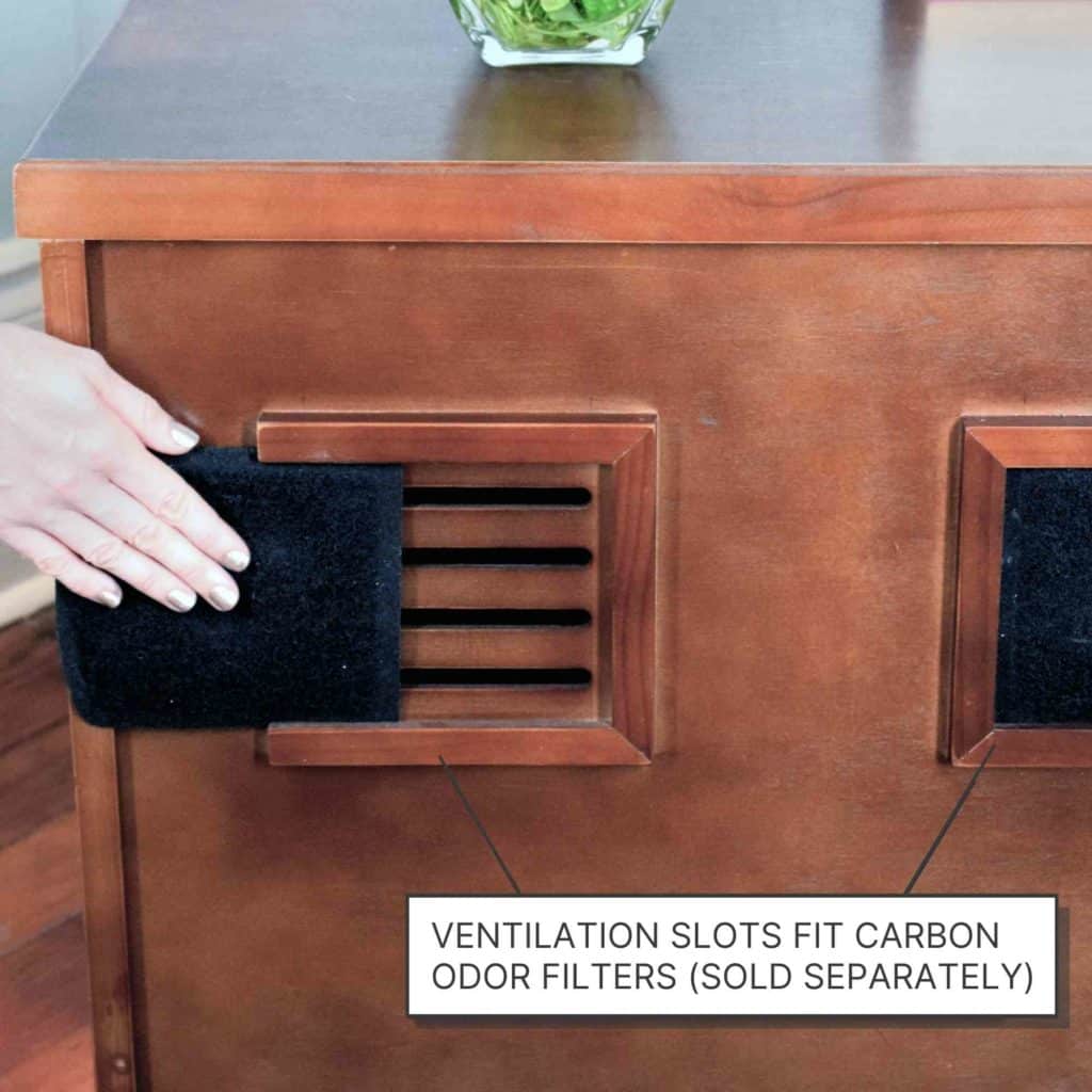 A hand places a rectangular carbon odor filter over ventilation slots. Onscreen text: Ventilation slots fit carbon odor filters.