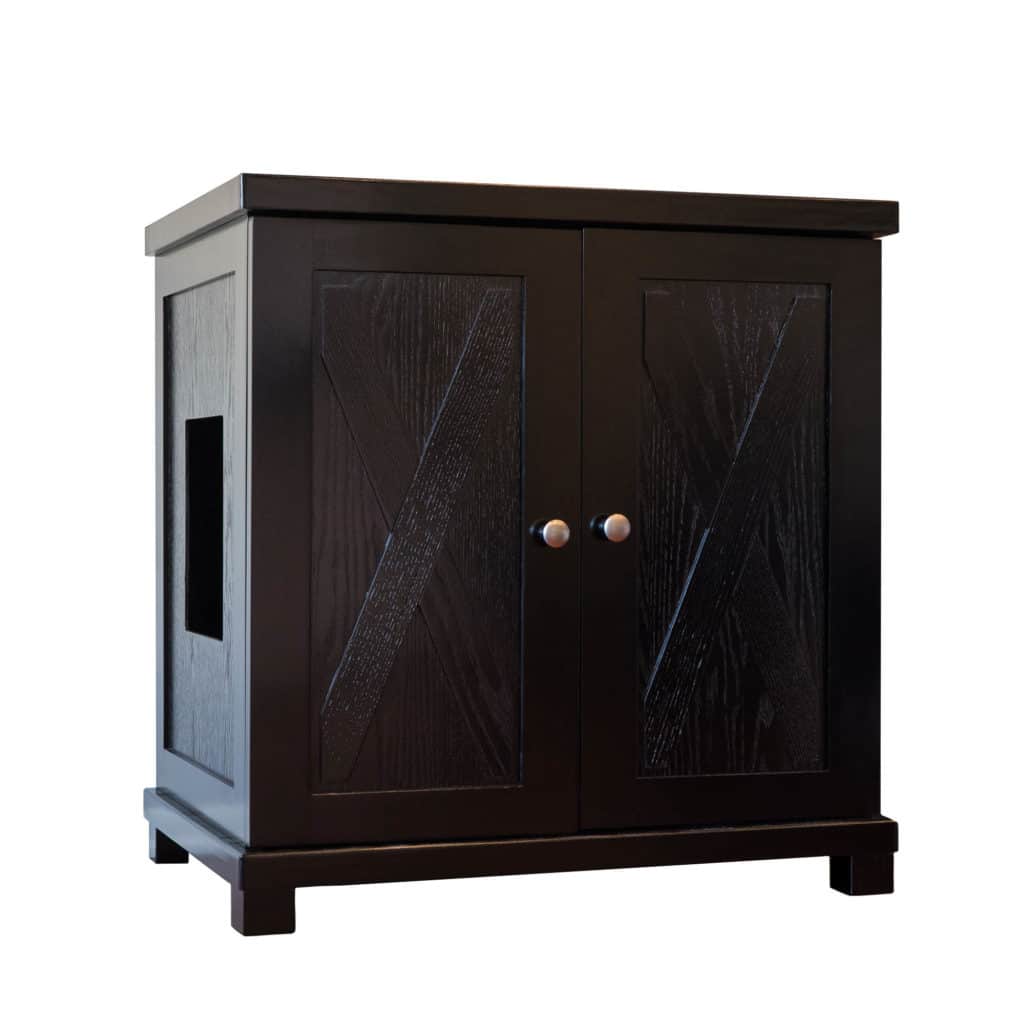 Black wooden cabinet with two front doors, decorative paneling, metal knobs, and a side cutout for cat access.