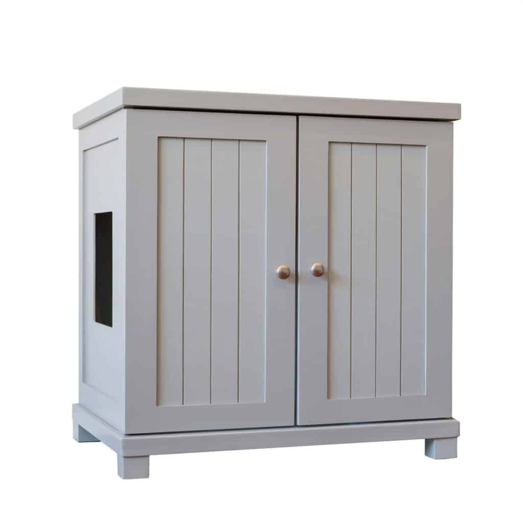 Light gray wooden cabinet with two paneled doors, round knobs, left cutout, and short legs.