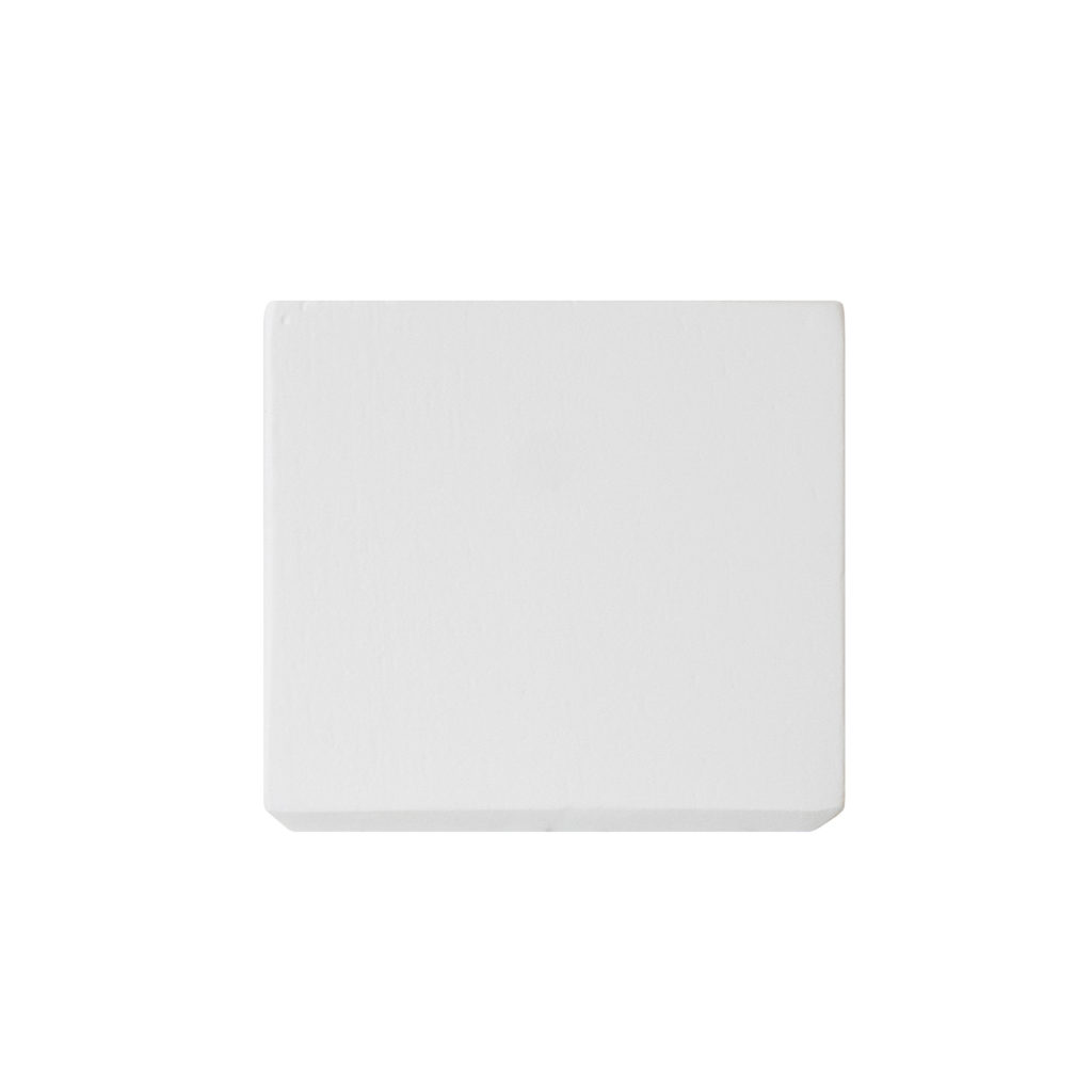 A sleek, square white object with smooth edges and a flat surface sits on a white background.