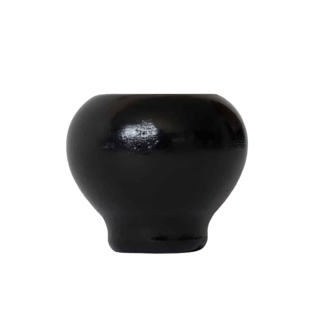 Small, round vessel with glossy black clay finish, wide body, and narrow base on a plain white background.