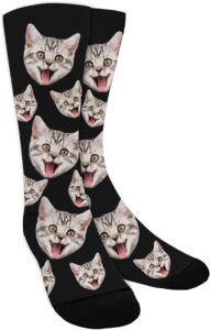 Black socks with playful gray tabby cat faces in varied sizes=